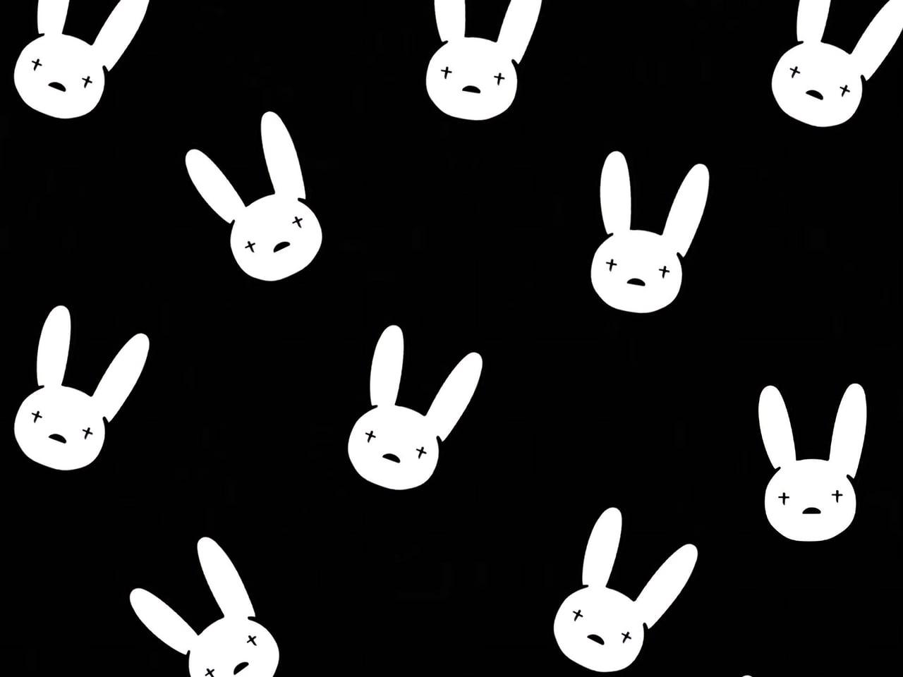 White bunny faces form a repeating pattern across a black background.