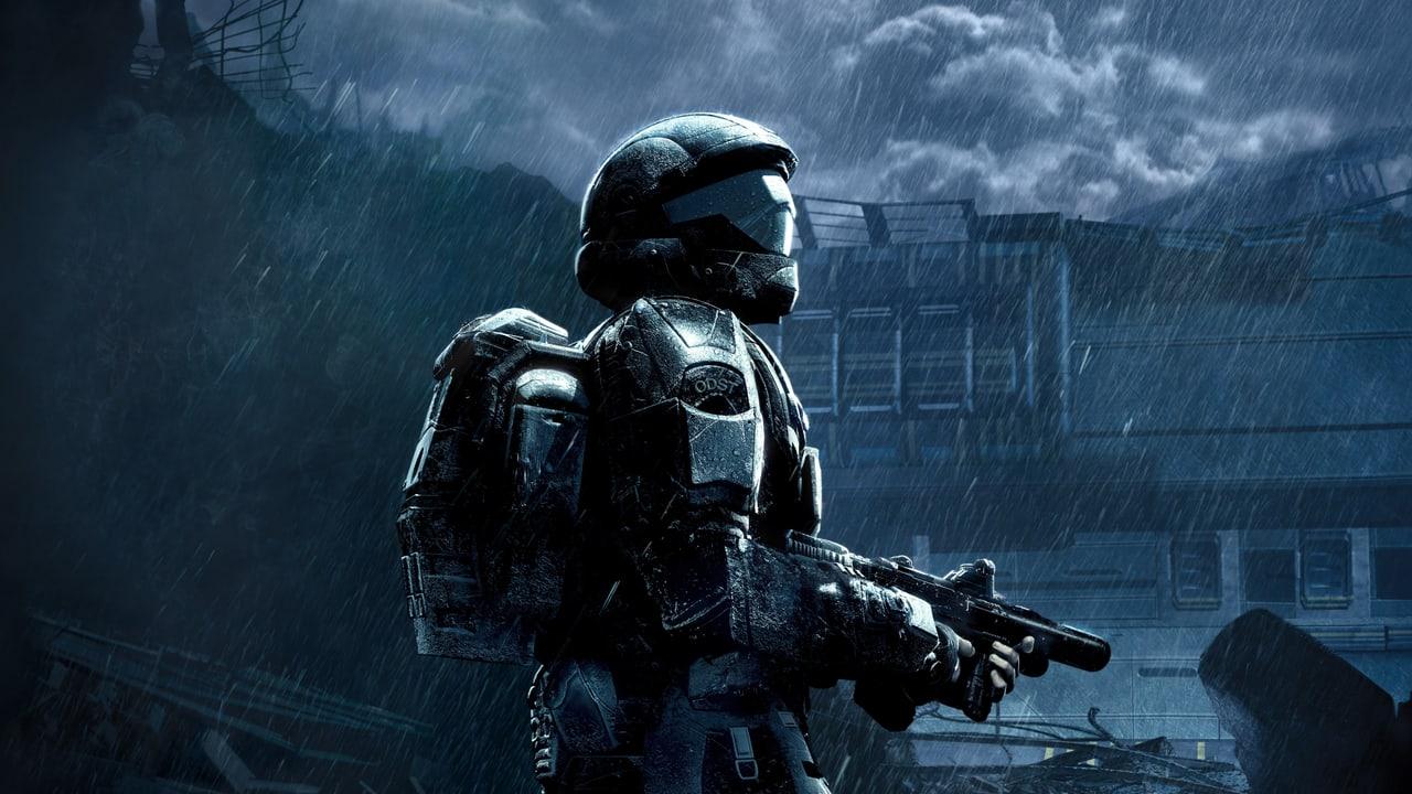 An armored soldier stands before a stepped ruin in heavy blue rain. Stone blocks, cloud cover and dark foliage carry the atmosphere across the background. Source: 4kwallpapers.com. Original artist not identified by the source page.