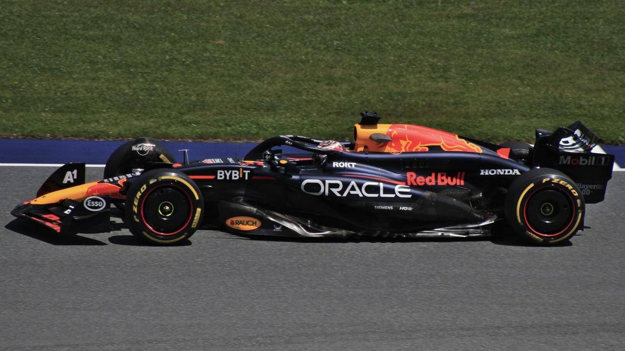 Max Verstappen’s number-one Red Bull Formula One car stretches across the frame in side profile at the Austrian Grand Prix.