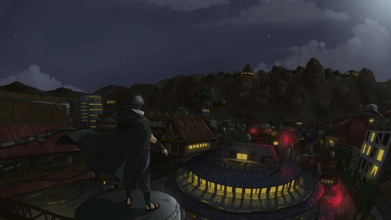Sasuke overlooks a dense night village with illuminated windows, tiled roofs and a cloudy sky.