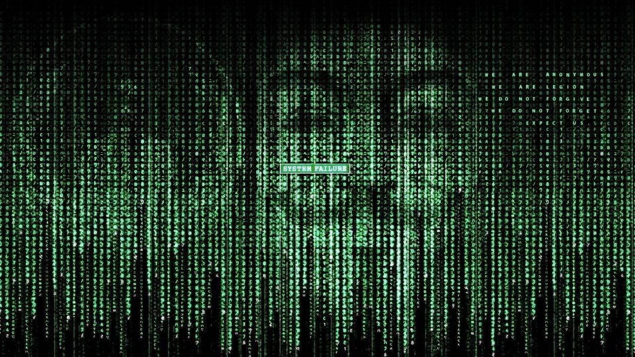 Faint faces emerge from dense columns of green symbols around a small system-failure message. The code repeats across the full width instead of ending at the portraits. Source: rond on Wallpapers.com. Original artist not identified by the page.