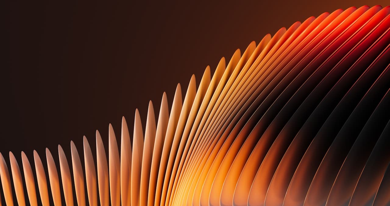 Abstract 3D composition of closely spaced curved fins forming a sweeping wave. Warm lighting creates gradients from amber gold to burnt orange and deep red, while the background remains a dark brown-black, boosting contrast. The fins' repetitive spacing produces a rhythmic, architectural pattern, and the curve suggests motion like a frozen ripple. Highlights run along the edges, giving the surfaces a smooth metallic or plastic feel. The framing is tight and cinematic, focusing on form and light. Mood is dramatic and warm.