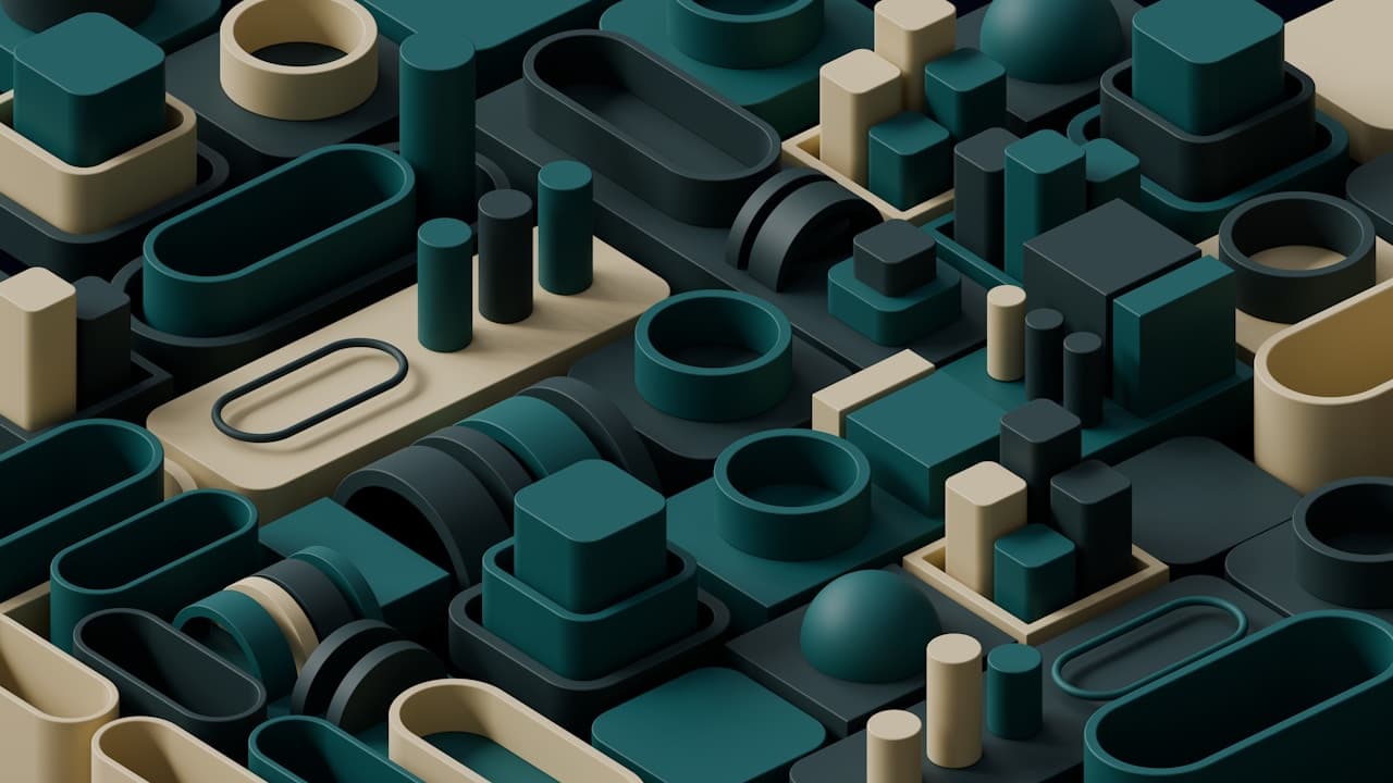 Abstract 3D render of interlocking pipes, fittings, and blocky shapes arranged like a modular industrial pattern. Rounded rectangles, tubes, and small pillars sit in a tight grid, colored in deep teal, dark gray, and warm cream. Smooth matte surfaces and soft shadows suggest controlled studio lighting, while the perspective gives the arrangement depth like a miniature city of plumbing parts. The frame is densely packed, with repeating forms and corners creating visual rhythm. Mood is clean, engineered, and contemporary.