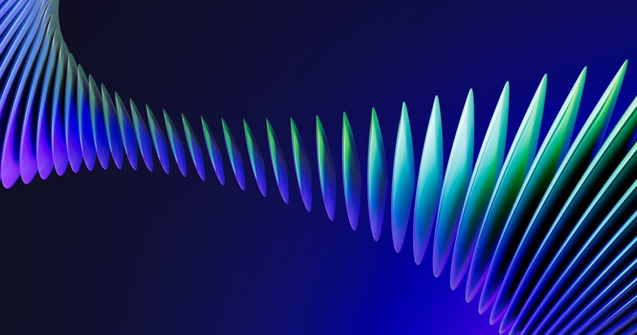 Futuristic abstract render of a long ribbon made of repeating blade-like fins stretching diagonally across a deep blue background. Colors shift smoothly from violet and indigo on one end to teal, cyan, and green on the other, creating a luminous gradient effect. The fins shrink into the distance, adding strong depth and perspective. Lighting is controlled and glossy, with soft highlights along the edges and darker shadows between elements. The composition is clean and minimal, designed as a modern wallpaper. Mood is cool, high-tech, and energetic.